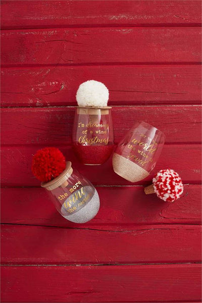 alt="Silver Christmas glitter wine glass with a gold ‘The more wine the merrier’ sentiment and arrives with red yarn and lurex pom cork bottle stopper"