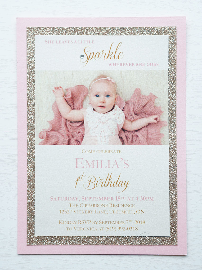 alt="Elegant photo birthday party invitation features an ivory pearlescent shimmer stock on rose gold glitter and pink pearlescent shimmer card stock layers, a photo of the honouree and 'She leaves a little sparkle wherever she goes' sentiment with jewel detail"