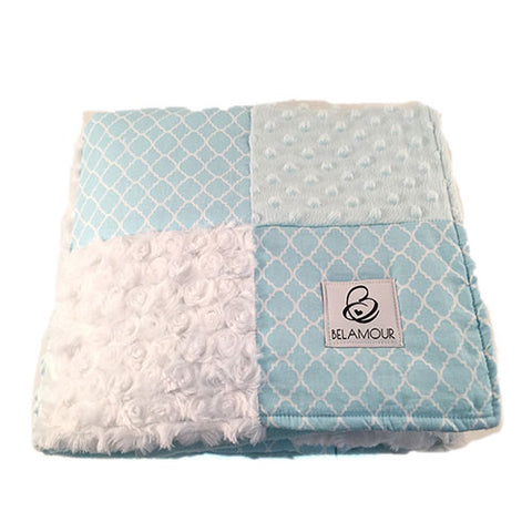 alt="Soft blue and crisp white cotton and chenille baby boy blanket with quatrefoil pattern"