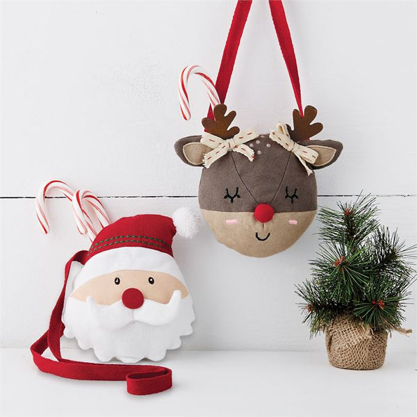alt=“Woven cotton red and white Santa purse stuffed for dimension features twill tape shoulder strap, embroidered features and snap button closure”