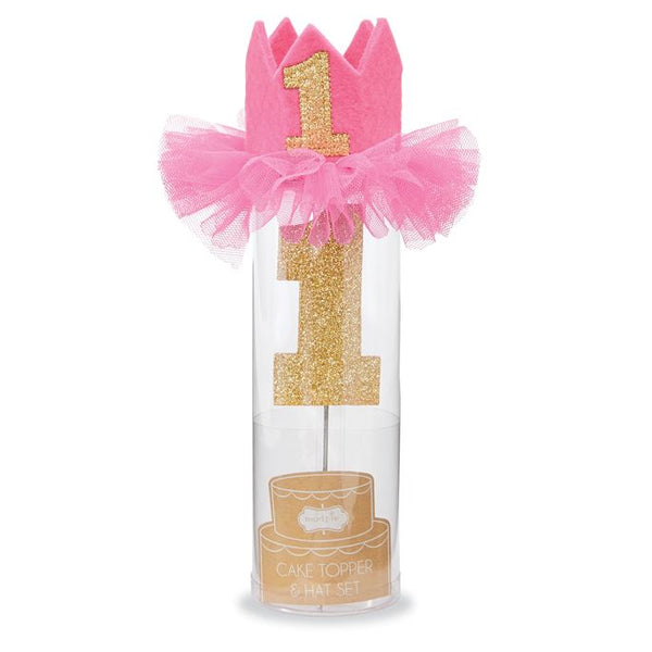 alt=“Pink felt birthday crown with elastic strap, mesh ruffles and a glitter 1 applique with a glitter 1 cake topper on stainless steel post to hold one standard size birthday candle”