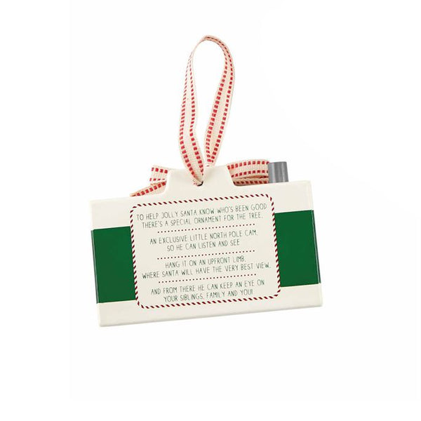 alt=“Green wooden Santa cam ornament with cotton ribbon hanger features printed poem about Santa keeping watch over the kids throughout the holiday season”