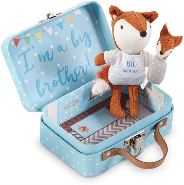 alt=“Pocket size cotton linen big brother fox features embroidered facial features, poplin tee, linen pants & velour tail, coordinating swaddled baby fox detaches with hook and loop closure in a blue fiberboard suitcase with printed nursery interior and poem on back”