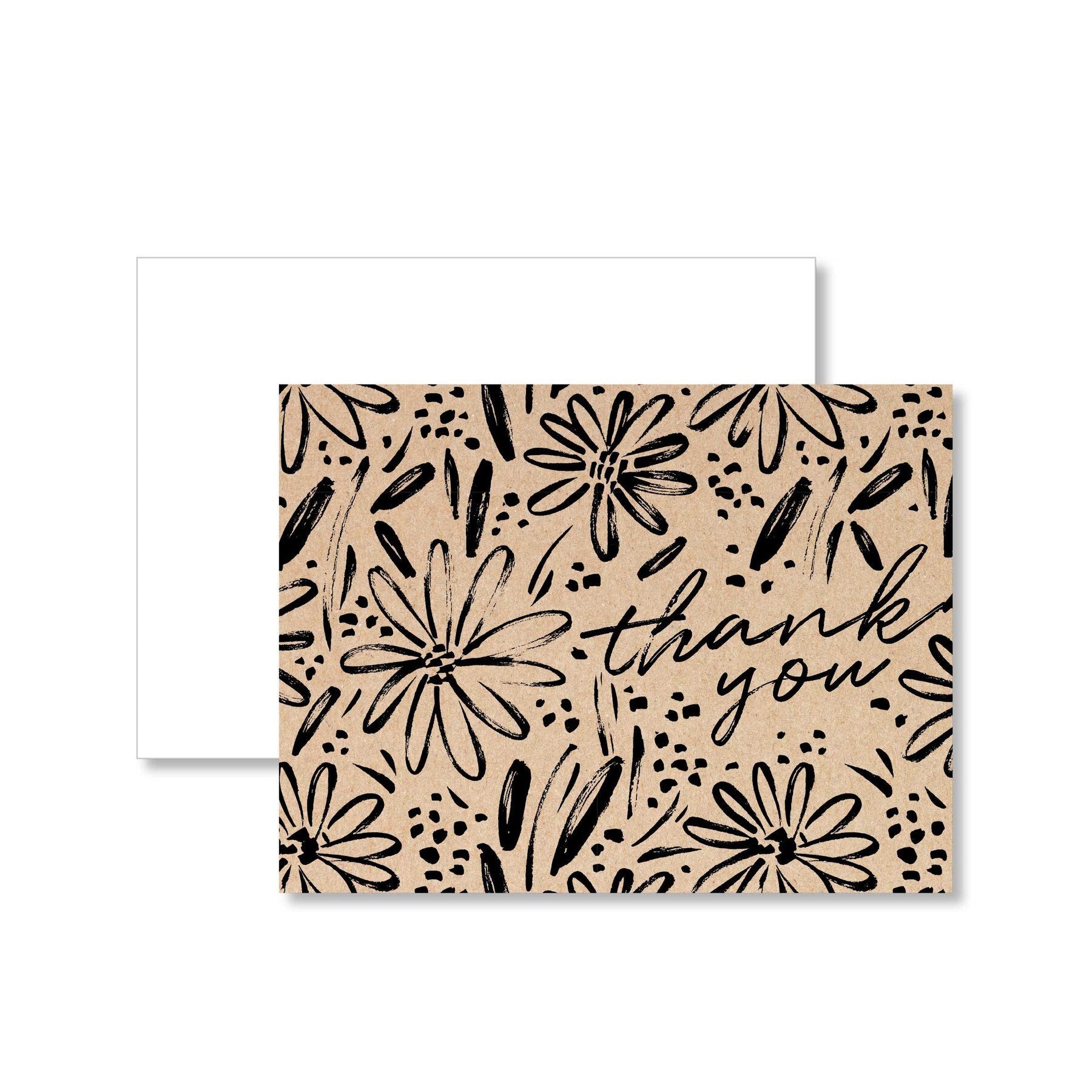 alt=“Kraft thank you note cards with a black floral design and a stylish script font. Includes 16 folded cards and 16 envelopes in a box”