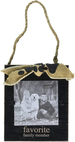 alt="Black distressed wood frame with paw print burlap bow features favorite family member sentiment with jute twine for hanging"