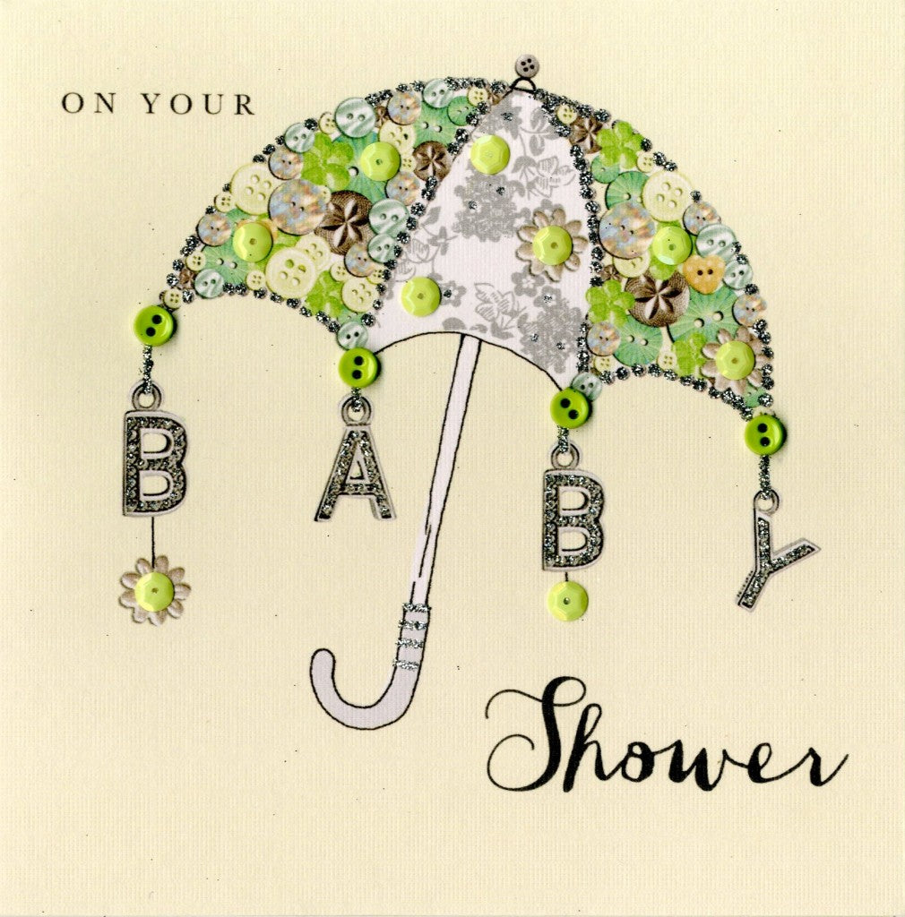 alt=“Baby Shower Umbrella quality hand-finished, green button, sequin and glitter embellished greeting card sealed in a protective wrapping complete with envelope. Message: On your Baby Shower. May life shower you and your baby with happiness and wonderful moments to treasure”
