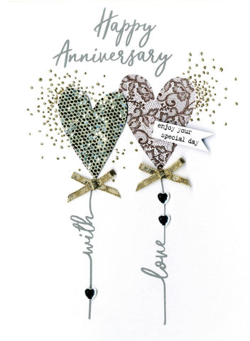 alt=“Anniversary quality hand-finished, silver and gold glitter embellished greeting card sealed in a protective wrapping complete with envelope. Message: Happy Anniversary enjoy your special day. Congratulations!”