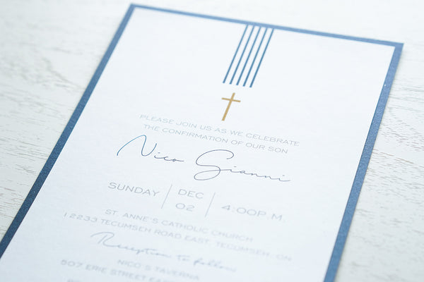 alt=“Modern Confirmation invitation features a white matte card stock on a blue pearlescent shimmer card stock finished with a simple gold cross and blue striped detail”