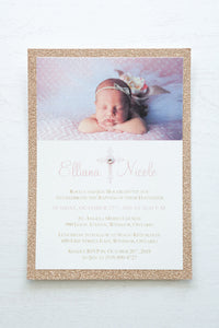 alt="Sweet glitter Baptism photo invitation features an ivory linen matte card stock on a rose gold glitter stock, an elegant pink cross and jewel detail with the honouree’s name and baby's photo"