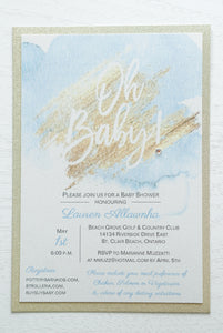 alt=“Trendy baby shower invitation features quartz pearlescent shimmer and gold glitter card stock layers and a blue and gold watercolour design with a sweet “Oh Baby!” sentiment and jewel detail”