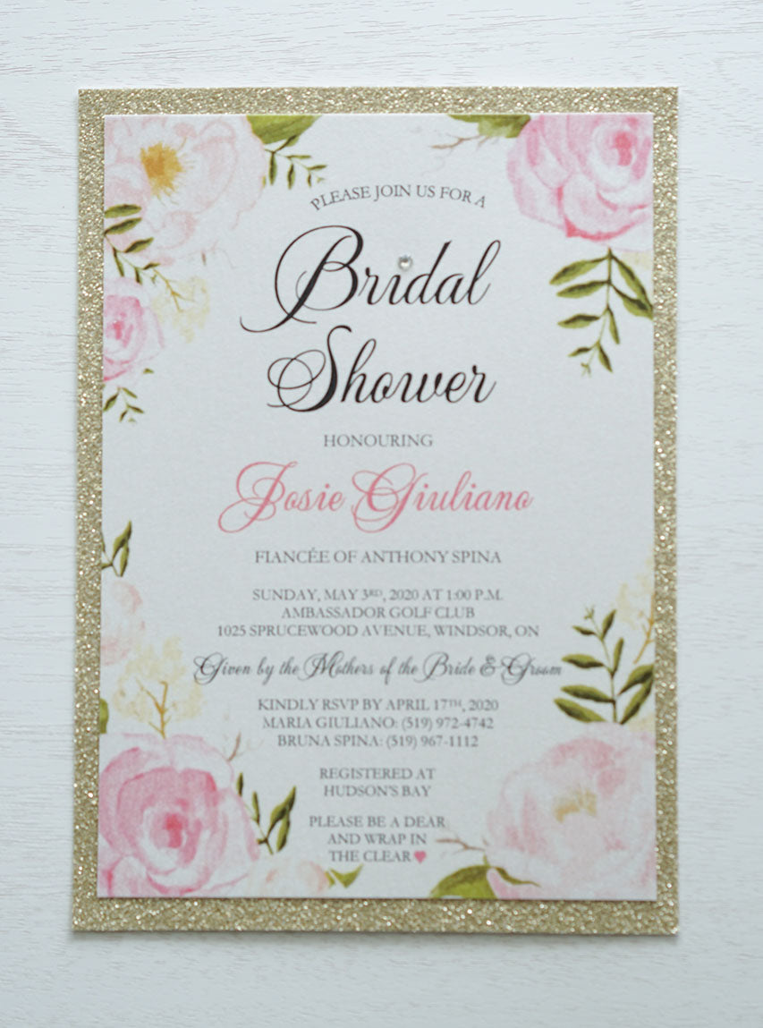alt="Stylish Bridal Shower invitation features a quartz pearlescent shimmer card stock on a gold glitter stock, an elegant pink watercolour floral frame design with a jewel detail to finish it off"