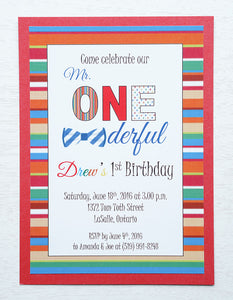 alt="Fun birthday party invitation features a matte white stock on a red pearlescent shimmer card stock, a colourful striped border and Mr. ONEderful finished with a bowtie detail"