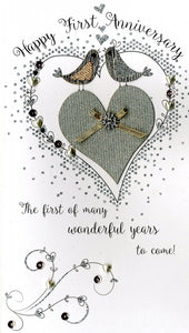Quality hand-finished, glitter embellished greeting card by Second Nature sealed in a protective wrapping complete with envelope.  Message: Happy First Anniversary. The first of many wonderful years to come!  With love and congratulations on this very special day.
