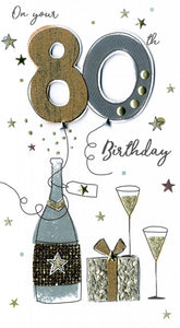 alt=“80th birthday quality hand-finished, glitter embellished greeting card with champagne bottle, glasses and present sealed in a protective wrapping complete with envelope. Message: On your 80th Birthday. Congratulations! May your special day be filled with happiness”