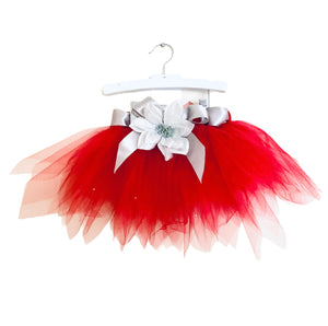 alt="This exclusive Belamour tutu made of the softest high quality red tulle and a rich silver satin ribbon, comes embellished with the sweetest silver floral accent and jewels"