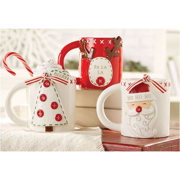 alt="White ceramic mug with Santa with button nose and HO HO HO sentiment on hat. Features red stitches around the top rim, button details on back and is finished with a festive ribbon"